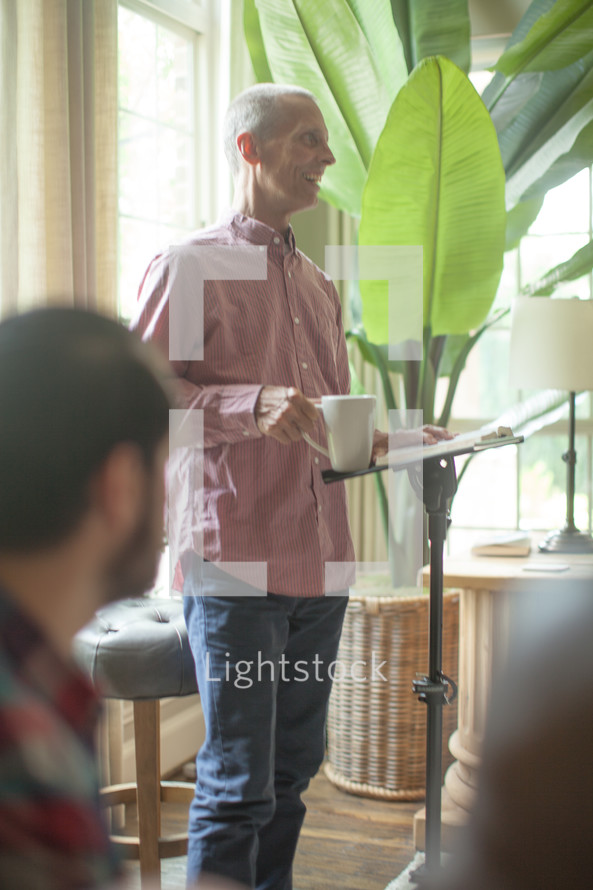 A man leading a home Bible study.