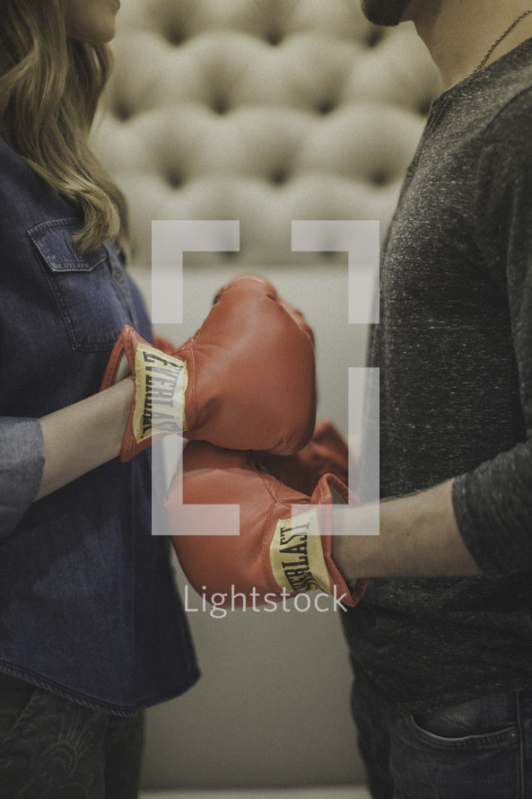 couple wearing boxing gloves 