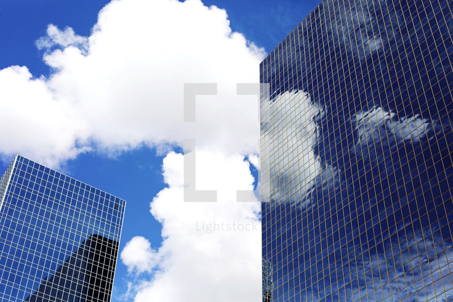 reflection of clouds on a mirrored windows 