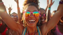 Happy young woman enjoying a music festival with her friends