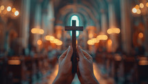 Hands holding a cross in a church. Christian religion concept.
