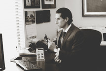 A businessman sitting at a desk 