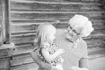 great-grandmother and great-granddaughter hugging 