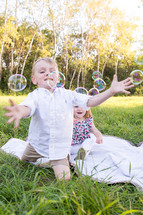 kids playing with bubbles 