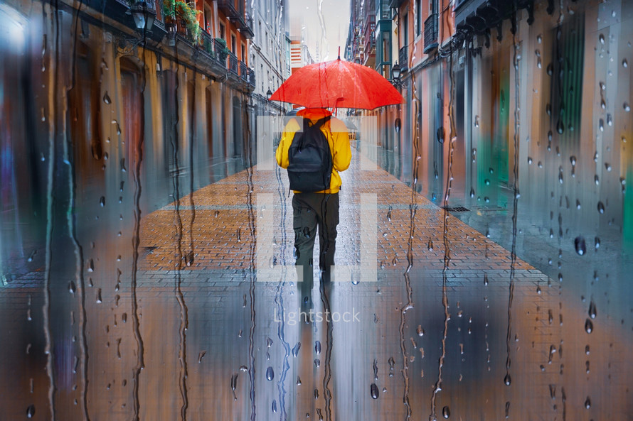 people with an umbrella in the city in rainy days in winter season
