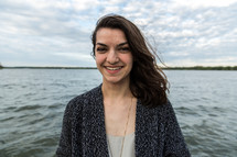 senior portrait of a teen girl near water 