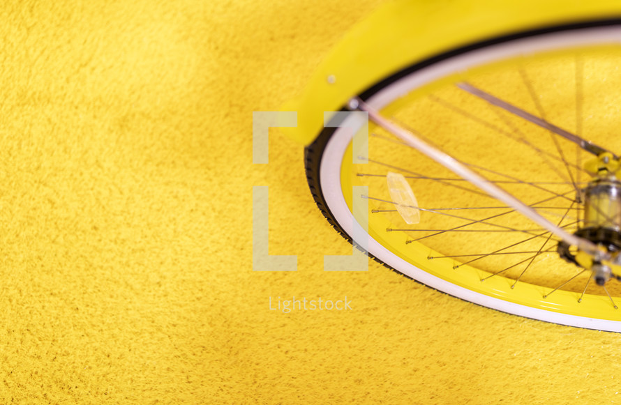 bike wheel on yellow 