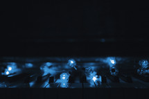 a piano keyboard with blue lights