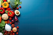 Fresh vegetables on a blue background. Top view with copy space.