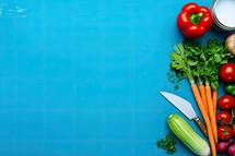 Vegetables on a blue background. Top view with copy space