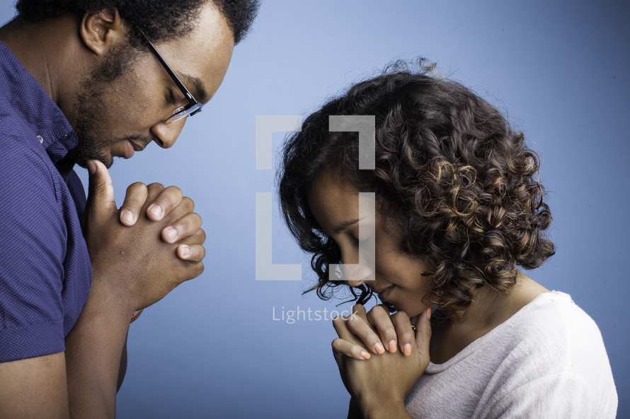 a couple praying 