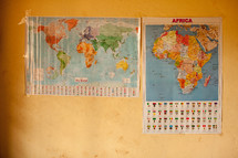 world map and  map of Africa in a classroom 