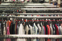 clothes on a rack in a store 