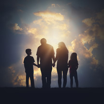 silhouette of a family in glowing sunlight 