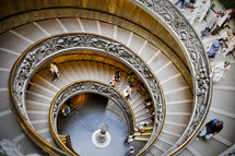 people on a spiral staircase 