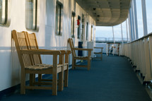 Wooden chairs on the deck of cruise liner