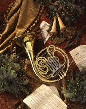 a french horn and sheet music - Christmas scene