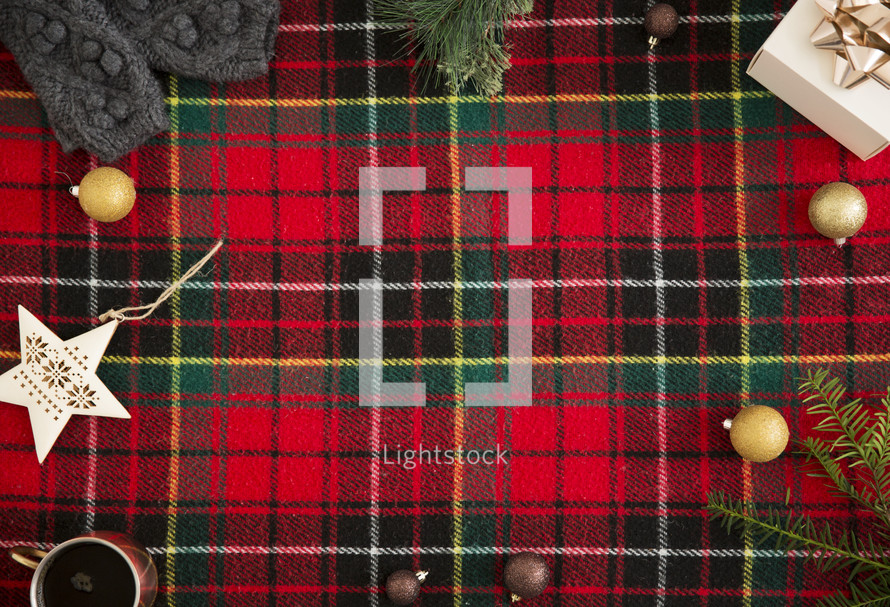 red plaid background with winter item border 
