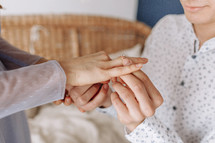 Close up young man putting wedding ring on woman bride finger, loving boyfriend proposing marriage to girlfriend, engagement, proposal acceptance concept, young couple decided getting married.