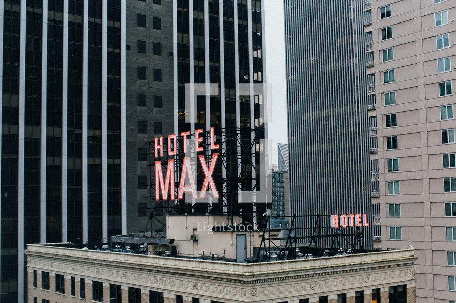 Hotel Max sign on the roof of a skyscraper 