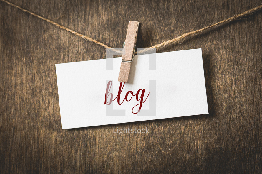 word blog on white card stock hanging from a clothespin on a clothesline 