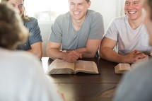 men laughing at a men's group Bible study.