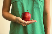 teacher holding an apple 