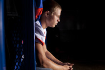 football player praying before a game 