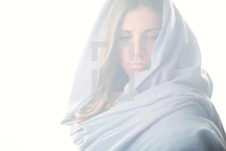 Mary in a blue shroud in bright light 