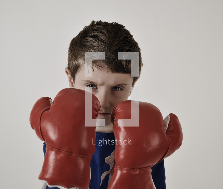 a boy with boxing gloves 
