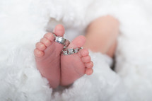 newborns feet and wedding bands