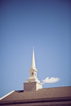 church steeple against blue sky