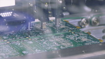 Surface mount technology machine places resistors, capacitors, transistors, LED and integrated circuits.