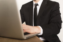 a businessman working at a laptop 
