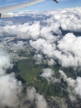 wing of a plane in flight over Hawaii 