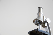 microscope against a white background 