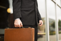 businessman carrying a briefcase 
