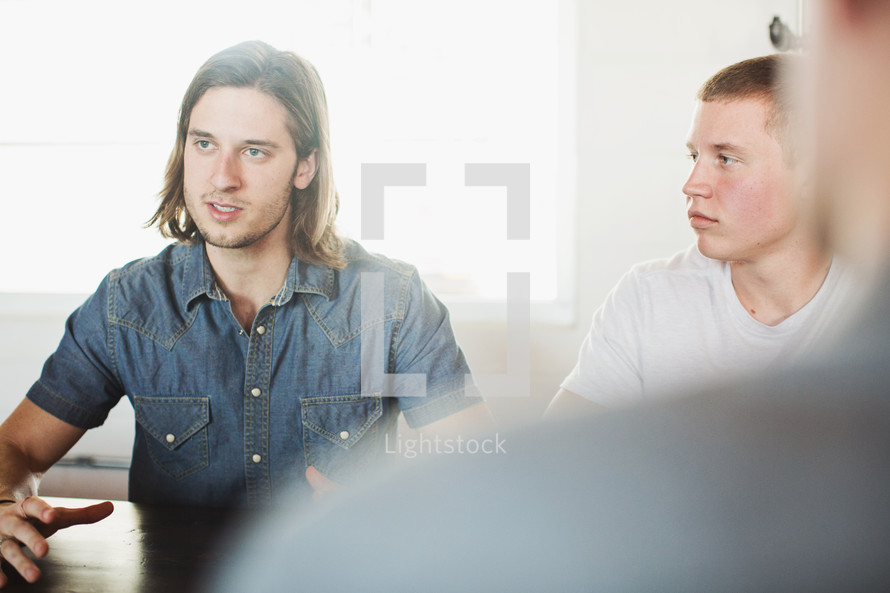 discussion between men at a Bible study 