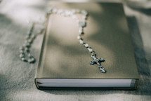 rosary on a Bible 