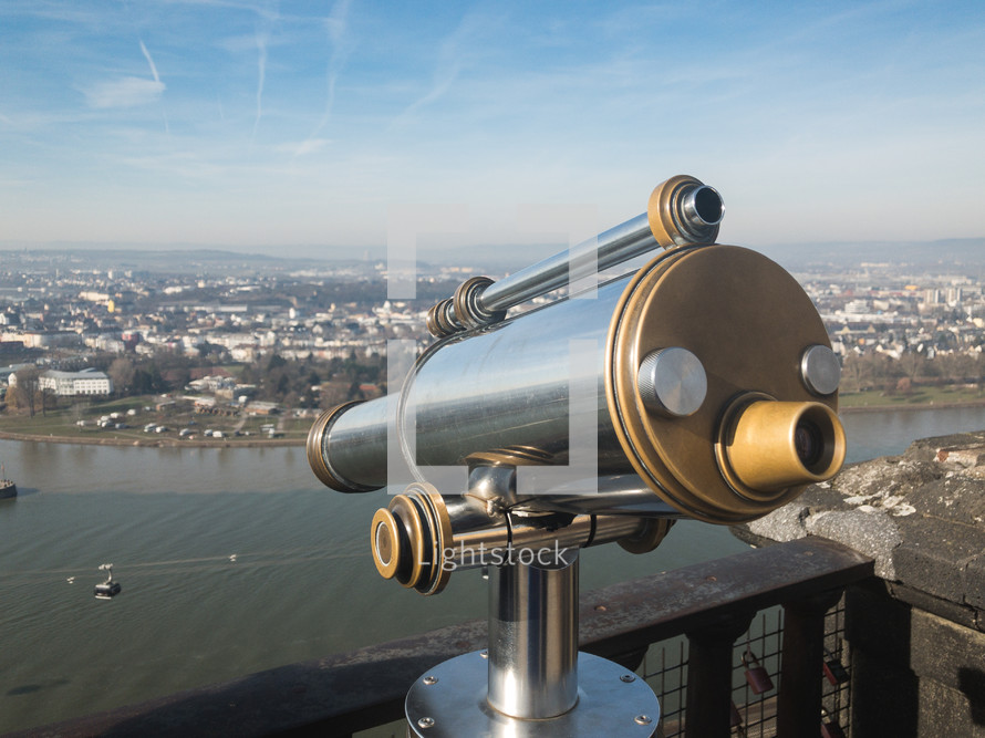 rooftop telescope looking out over a river 