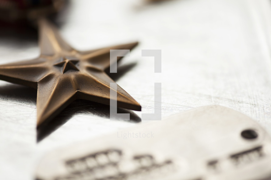 close up of military star and dog tags.
