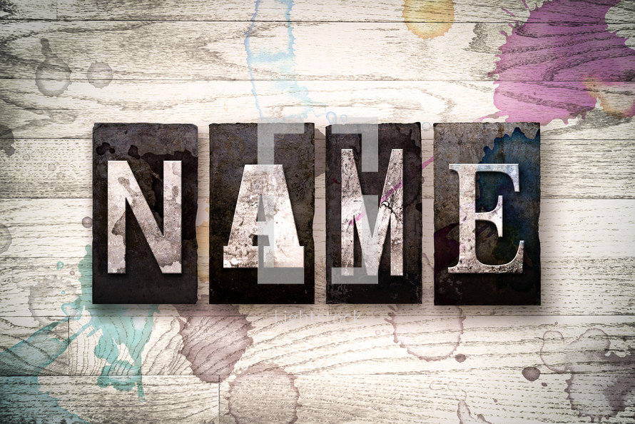 word name on a white wash wood background 