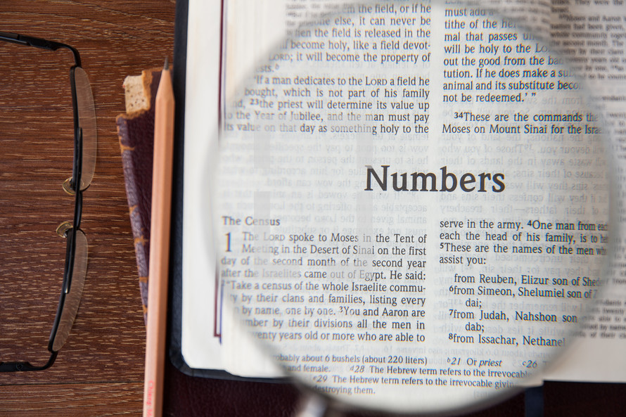 magnifying glass over Numbers