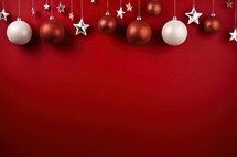 Christmas background with baubles and stars on a red background.