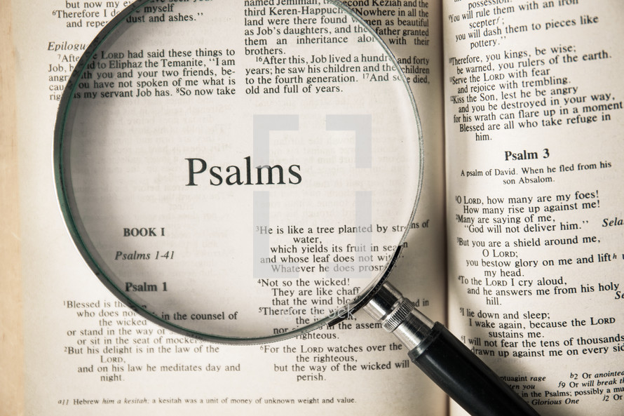 magnifying glass over Bible - Psalms 