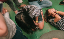 group kneeling at a worship service 
