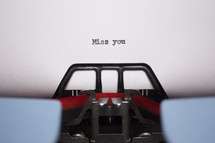 words miss you typed on a typewriter 