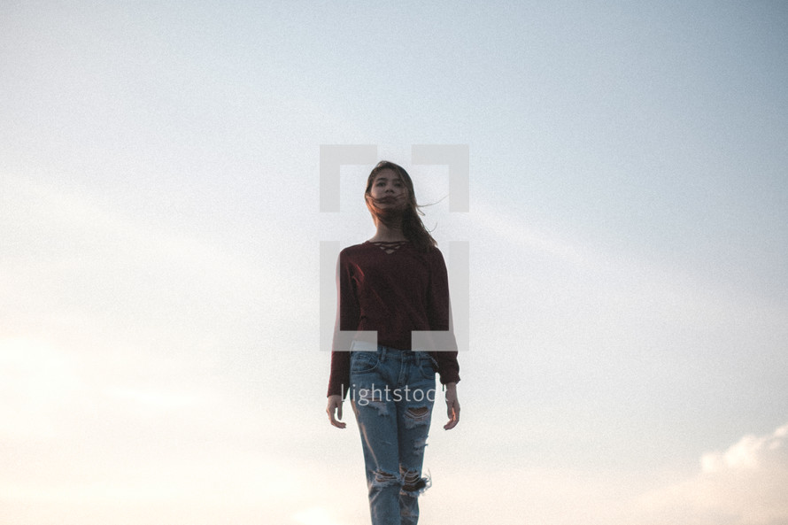 young woman with sky background 