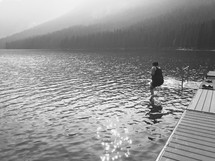 iPhone capture of a woman jumping into cold mountain lake water