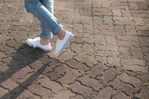 female walking in sneakers 